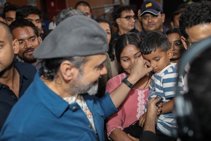 Playful Moment with a Young Gita Student