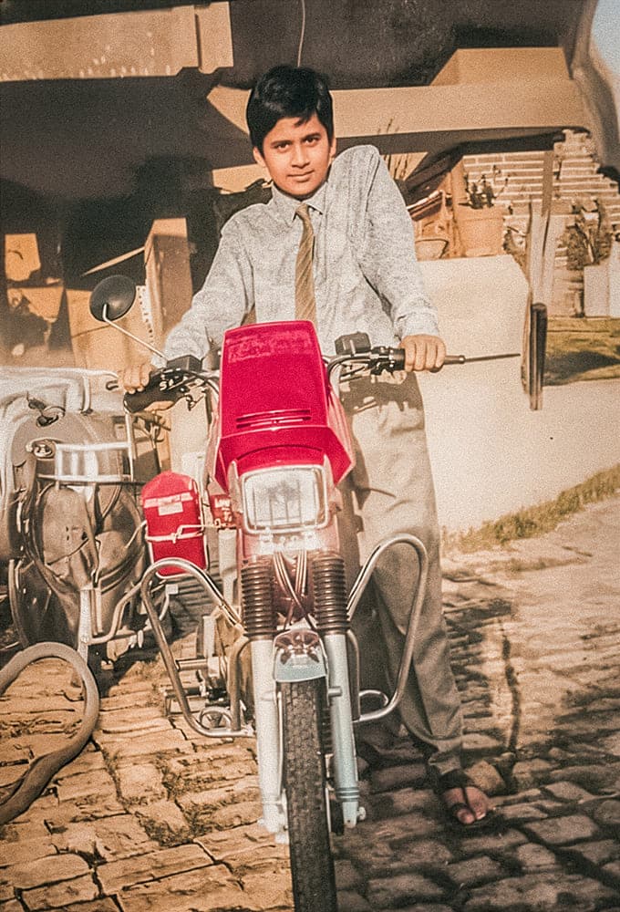 With the moped gifted by his grandfather after topping Class 10.